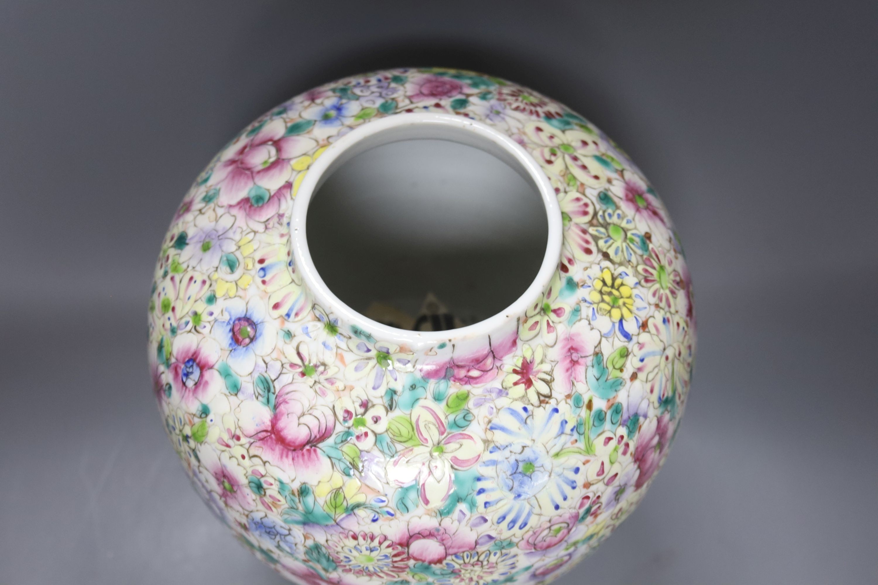A Chinese thousand flower famille rose jar and cover, early 20th century, wood stand 28cm